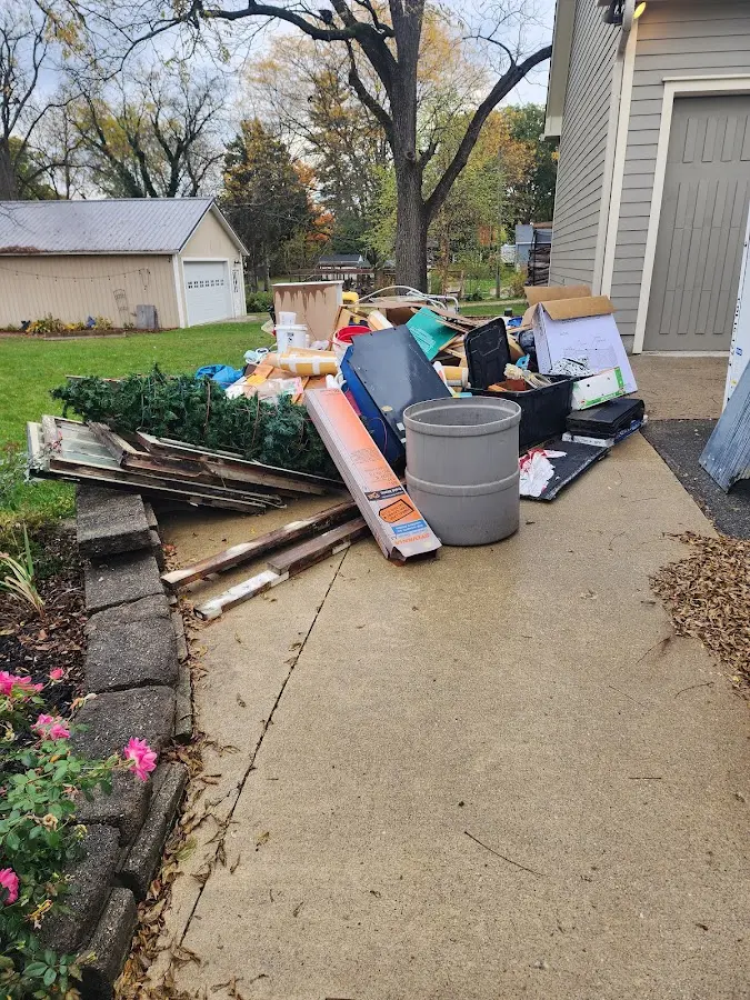 Dumpster being loaded with debris for Roofing Dumpster Rental in Saranap